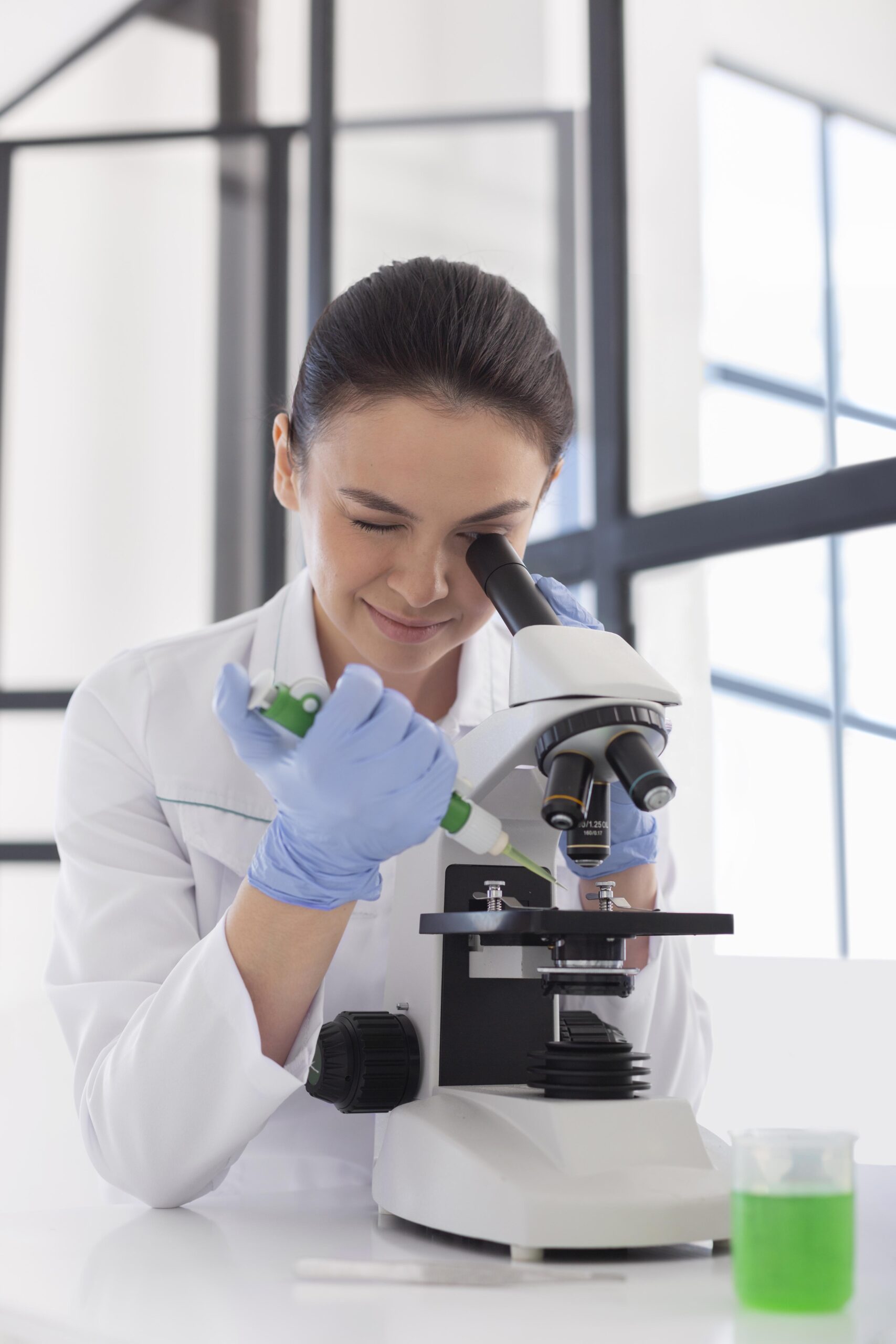 scientist-working-with-microscope-medium-shot